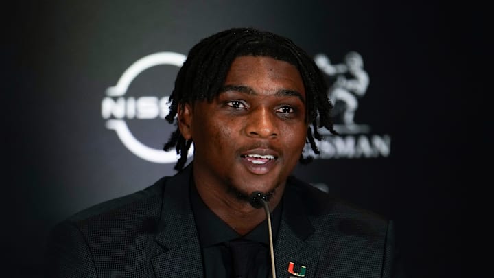 Dec 14, 2024; New York, NY, USA; Miami Hurricanes quarterback Cam Ward speaks on stage during a press conference before the 2024 Heisman Trophy Presentation. Mandatory Credit: Lucas Boland-Imagn Images