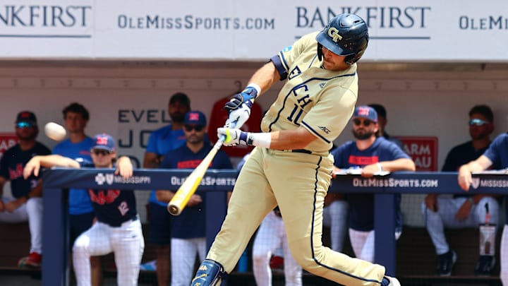 Jun 1, 2025; Oxford, MS, USA; Georgia Tech Yellowjackets first baseman Kent Schmidt (10) hits a home run during the first inning against the Mississippi Rebels. Mandatory Credit: Petre Thomas-Imagn Images Jun 1, 2025; Oxford, MS, USA; Georgia Tech Yellowjackets first baseman Kent Schmidt (10) hits a home run during the first inning against the Mississippi Rebels. Mandatory Credit: Petre Thomas-Imagn Images