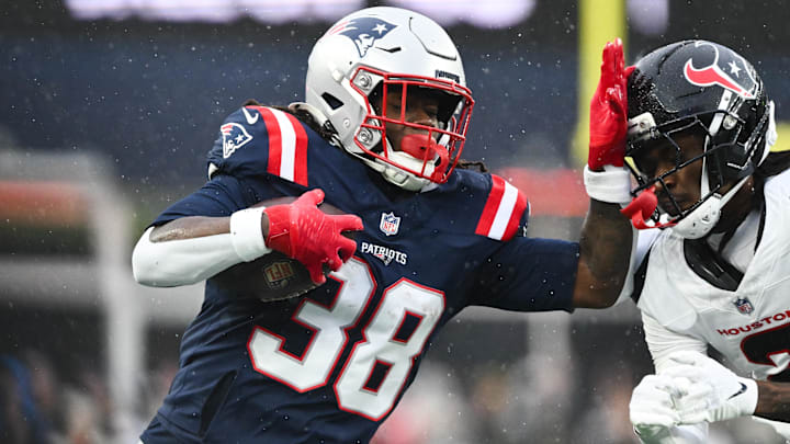 New England Patriots running back Rhamondre Stevenson (38) moves with the ball in the first quarter in an AFC Divisional Round game against the Houston Texans at Gillette Stadium. 
