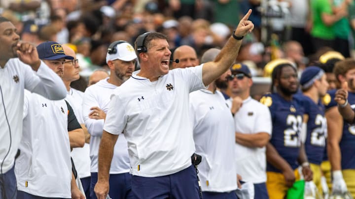 Sep 20, 2025; South Bend, Indiana, USA; Notre Dame Fighting Irish defensive coordinator Chris Ash shouts towards the field against the Purdue Boilermakers during the first half at Notre Dame Stadium. Mandatory Credit: Michael Caterina-Imagn Images Sep 20, 2025; South Bend, Indiana, USA; Notre Dame Fighting Irish defensive coordinator Chris Ash shouts towards the field against the Purdue Boilermakers during the first half at Notre Dame Stadium. Mandatory Credit: Michael Caterina-Imagn Images