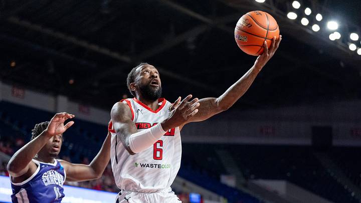 The Ville's Russ Smith (6) goes for a layup against Sideline Cancer's Marcellus Earlington (11) during their game on Monday, July 22, 2024 in Louisville, Ky. at Freedom Hall during the second round of The Basketball Tournament. The Ville's Russ Smith (6) goes for a layup against Sideline Cancer's Marcellus Earlington (11) during their game on Monday, July 22, 2024 in Louisville, Ky. at Freedom Hall during the second round of The Basketball Tournament.