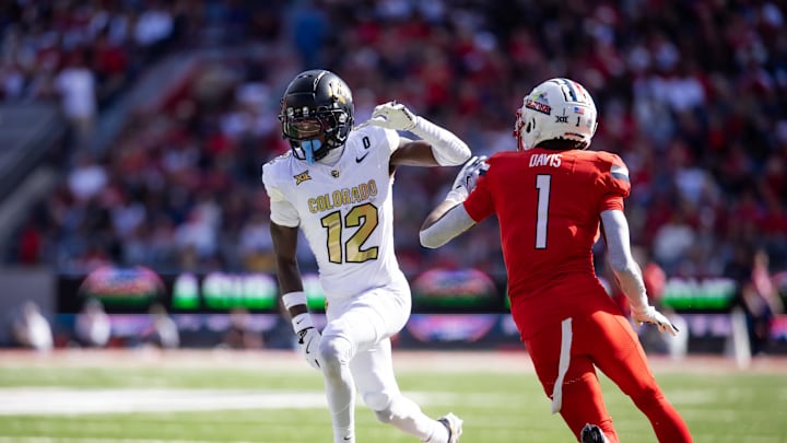 Oct 19, 2024; Tucson, Arizona, USA; Colorado Buffalos wide receiver Travis Hunter (12) against Arizona Wildcats cornerback Tacario Davis (1) at Arizona Stadium. Mandatory Credit: Mark J. Rebilas-Imagn Images