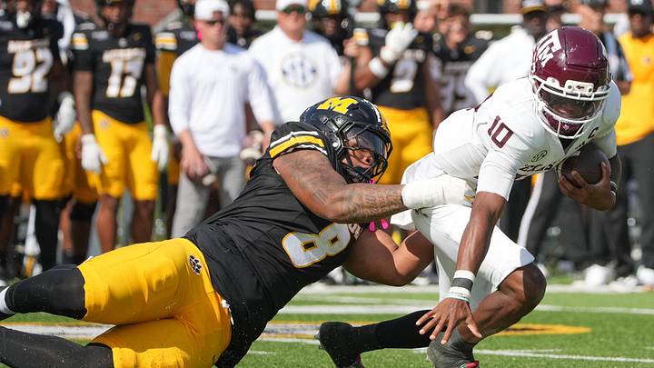 Oct 10, 2026; Columbia, Missouri, USA; Texas A&M Aggies quarterback Marcel Reed (10) is sacked by Missouri Tigers defensive tackle Donta Simpson (8) during the first half of the game at Faurot Field at Memorial Stadium. Mandatory Credit: Denny Medley-Imagn Images Oct 10, 2026; Columbia, Missouri, USA; Texas A&M Aggies quarterback Marcel Reed (10) is sacked by Missouri Tigers defensive tackle Donta Simpson (8) during the first half of the game at Faurot Field at Memorial Stadium. Mandatory Credit: Denny Medley-Imagn Images
