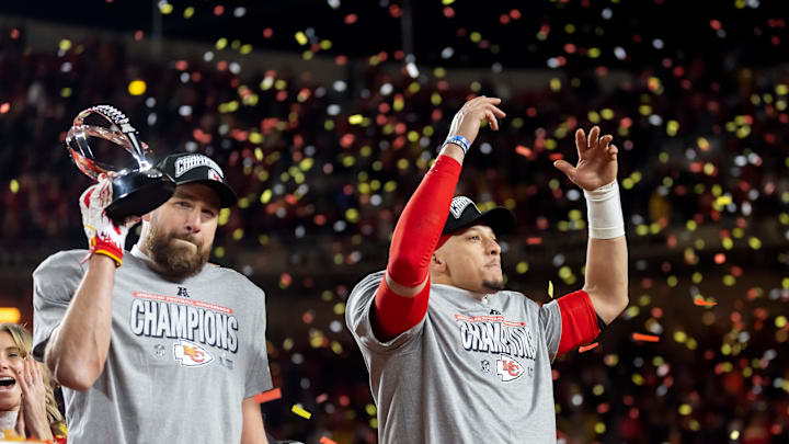 Jan 26, 2025; Kansas City, MO, USA; Confetti falls as Kansas City Chiefs tight end Travis Kelce (left) celebrates with the Lamar Hunt Trophy with quarterback Patrick Mahomes after defeating the Buffalo Bills during the AFC Championship game at GEHA Field at Arrowhead Stadium. Mandatory Credit: Mark J. Rebilas-Imagn Images Jan 26, 2025; Kansas City, MO, USA; Confetti falls as Kansas City Chiefs tight end Travis Kelce (left) celebrates with the Lamar Hunt Trophy with quarterback Patrick Mahomes after defeating the Buffalo Bills during the AFC Championship game at GEHA Field at Arrowhead Stadium. Mandatory Credit: Mark J. Rebilas-Imagn Images