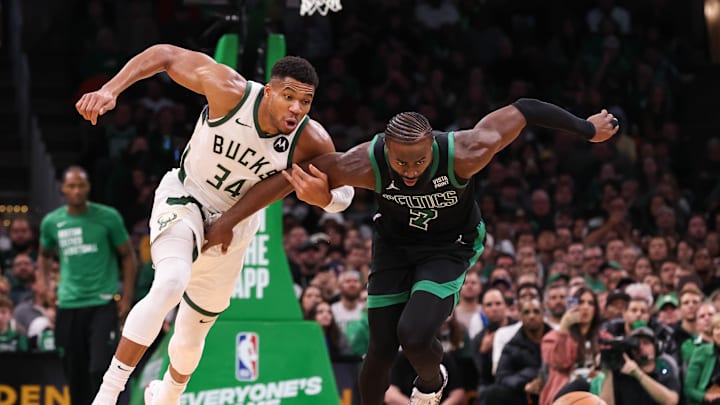 Nov 22, 2023; Boston, Massachusetts, USA; Milwaukee Bucks forward Giannis Antetokounmpo (34) and Boston Celtics forward Jaylen Brown (7) fight for the ball during the second half at TD Garden. Mandatory Credit: Paul Rutherford-Imagn Images