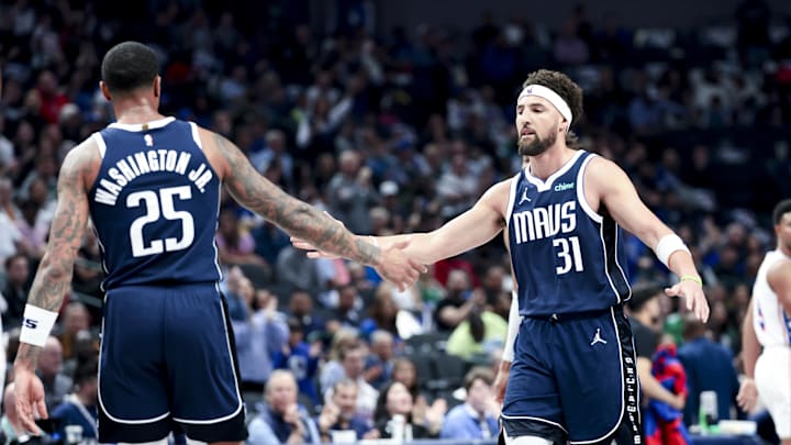 Mar 16, 2025; Dallas, Texas, USA;  Dallas Mavericks forward P.J. Washington (25) celebrates with Dallas Mavericks guard Klay Thompson (31) against the Philadelphia 76ers during the first half at American Airlines Center. Mandatory Credit: Kevin Jairaj-Imagn Images