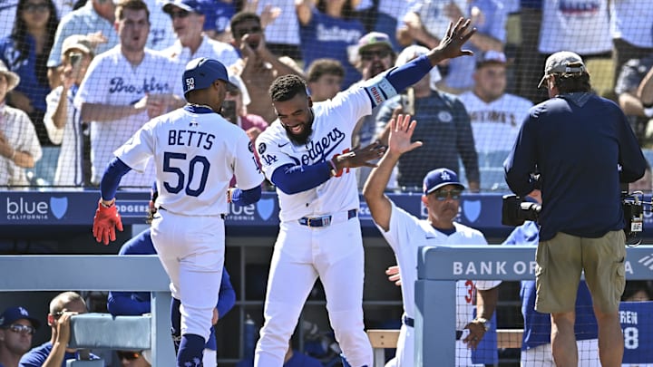 Aug 17, 2025; Los Angeles, California, USA; Los Angeles Dodgers shortstop Mookie Betts (50) celebrates with outfielder Teoscar Hernandez (37) after hitting a solo home run against the San Diego Padres during the eighth inning at Dodger Stadium. Mandatory Credit: Jonathan Hui-Imagn Images
