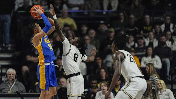 Feb 1, 2025; Winston-Salem, North Carolina, USA; Pittsburgh Panthers guard Jaland Lowe (15) shoots over Wake Forest Demon Deacons guard Ty-Laur Johnson (8) during the first half at Lawrence Joel Veterans Memorial Coliseum. Mandatory Credit: Jim Dedmon-Imagn Images