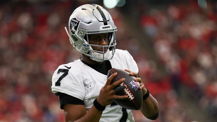 Dec 21, 2025; Houston, Texas, USA ;Las Vegas Raiders quarterback Geno Smith (7) warms up on the sidelines before his first series against the Houston Texans in the first quarter at NRG Stadium. Mandatory Credit: Thomas Shea-Imagn Images