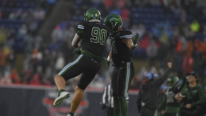 Dec 27, 2023; Annapolis, MD, USA;  Tulane Green Wave defensive end Devean Deal (90) and defensive end Michael Lunz (44) celebrate during the third quarter against the Virginia Tech Hokies at Navy-Marine Corps Memorial Stadium.