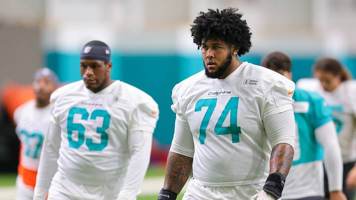 Miami Dolphins guard Kadyn Proctor (74) looks on during practice at Baptist Health Training Complex.