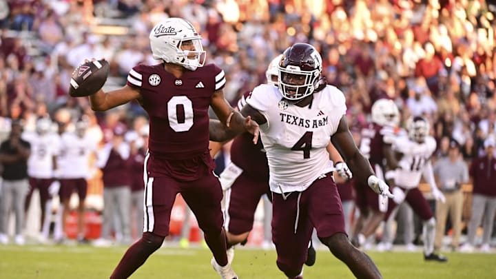 Oct 19, 2024; Starkville, Mississippi, USA;Mississippi State Bulldogs quarterback Michael Van Buren Jr. (0) drops back to pass against Texas A&M Aggies defensive lineman Shemar Stewart (4) during the third quarter at Davis Wade Stadium at Scott Field. Mandatory Credit: Matt Bush-Imagn Images