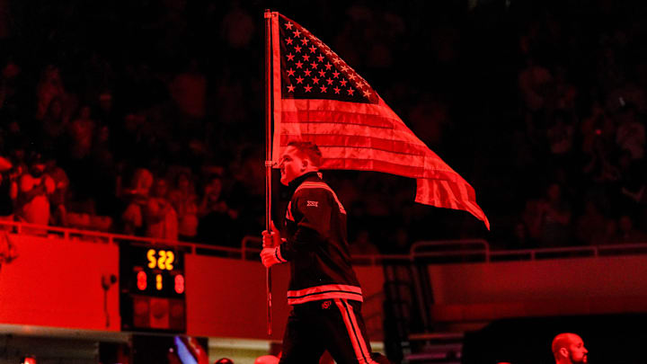 Oklahoma State’s Wyatt Hendrickson runs onto the mat with an American flag before an NCAA wrestling meet between Oklahoma State and Missouri at Gallagher-Iba Arena in Stillwater, Okla., on Sunday, Feb. 2, 2025. Oklahoma State’s Wyatt Hendrickson runs onto the mat with an American flag before an NCAA wrestling meet between Oklahoma State and Missouri at Gallagher-Iba Arena in Stillwater, Okla., on Sunday, Feb. 2, 2025.
