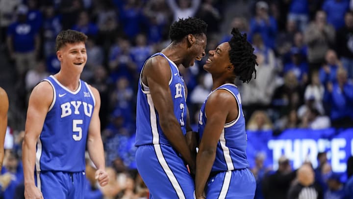 Jan 24, 2026; Provo, Utah, USA; BYU Cougars forward AJ Dybantsa (3) celebrates with guard Robert Wright III (1) during the second half against the Utah Utes at Marriott Center. Mandatory Credit: Aaron Baker-Imagn Images 