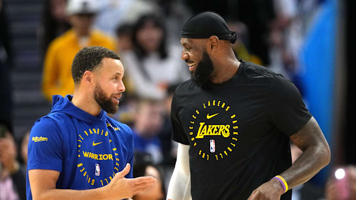 Dec 25, 2024; San Francisco, California, USA; Golden State Warriors guard Stephen Curry (left) and Los Angeles Lakers forward LeBron James (right) talk before the game at Chase Center.