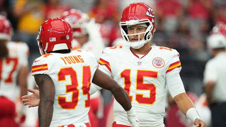Kansas City Chiefs quarterback Patrick Mahomes (15) greets teammate Elijah Young (34) before their preseason game against the Arizona Cardinals at State Farm Stadium on Aug. 9, 2025.