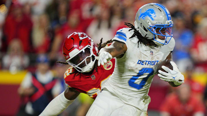 Oct 12, 2025; Kansas City, Missouri, USA; Detroit Lions running back Jahmyr Gibbs (0) rushes the ball past Kansas City Chiefs linebacker Nick Bolton (32) during the second half at GEHA Field at Arrowhead Stadium. Mandatory Credit: Jay Biggerstaff-Imagn Images