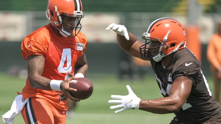 Jul 28, 2022; Berea, OH, USA; Cleveland Browns quarterback Deshaun Watson (4) hands off to running back Nick Chubb (24) during training camp at CrossCountry Mortgage Campus. Mandatory Credit: Ken Blaze-USA TODAY Sports