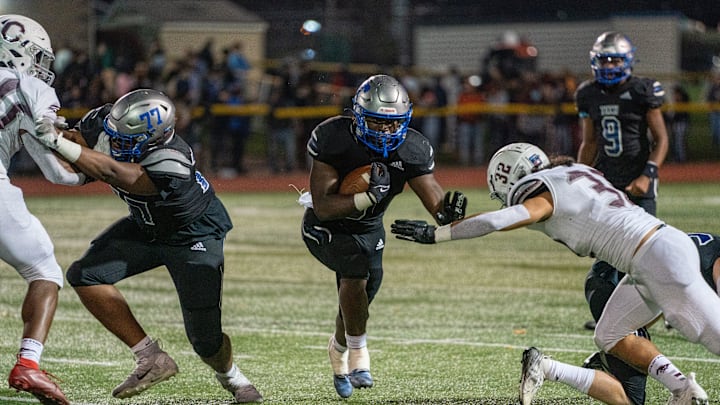 Passaic Tech's Trashon Dye (3) breaks a tackle by Clifton's Marcos Betances (32) during a run with the ball during the NJSIAA North 1, Group 5 semifinal between Clifton and Passaic Tech at Passaic County Technical Institute in Wayne, NJ on Friday, November 4, 2022.
