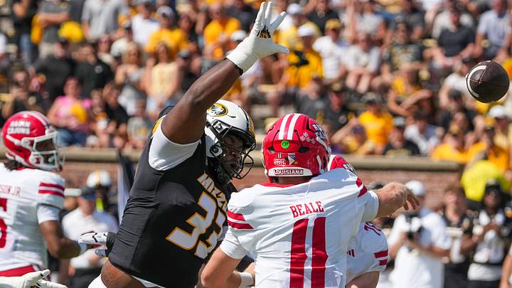 Sep 13, 2025; Columbia, Missouri, USA; Louisiana-Lafayette Ragin Cajuns quarterback Daniel Beale (11) throws a pass as Missouri Tigers defensive tackle Marquis Gracial (33) tries to block during the first half of the game at Faurot Field at Memorial Stadium. Mandatory Credit: Denny Medley-Imagn Images Sep 13, 2025; Columbia, Missouri, USA; Louisiana-Lafayette Ragin Cajuns quarterback Daniel Beale (11) throws a pass as Missouri Tigers defensive tackle Marquis Gracial (33) tries to block during the first half of the game at Faurot Field at Memorial Stadium. Mandatory Credit: Denny Medley-Imagn Images