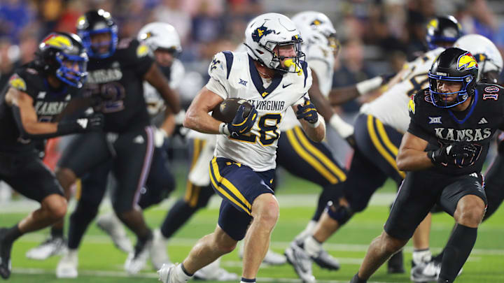 West Virginia Mountaineers running back Tyler Jacklich (28) runs the ball during the second half of the game against Kansas Jayhawks at David Booth Kansas Memorial Stadium on Sept. 20, 2025.