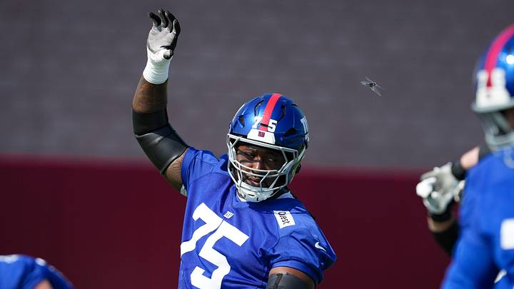 New York Giants guard Joshua Ezeudu (75) stretches as a bug flies by on day two of training camp at Quest Diagnostics Giants Training Center, Jul 24, 2025, East Rutherford, NJ, USA.