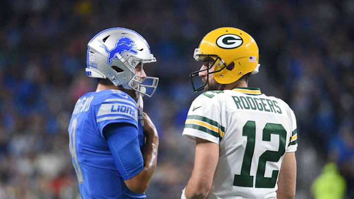 Oct 7, 2018; Detroit, MI, USA; Detroit Lions quarterback Matthew Stafford (9) and Green Bay Packers quarterback Aaron Rodgers (12) chat during the first quarter at Ford Field. Mandatory Credit: Tim Fuller-USA TODAY Sports