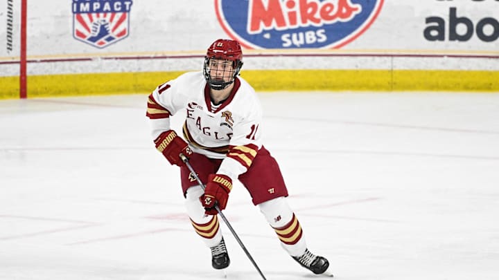 Feb 28, 2025; Chestnut Hill, MA, USA; Boston College defenseman Michael Hagens (11) skates with the puck against the University of New Hampshire Wildcats during the second period at Conte Forum. Mandatory Credit: Eric Canha-Imagn Images