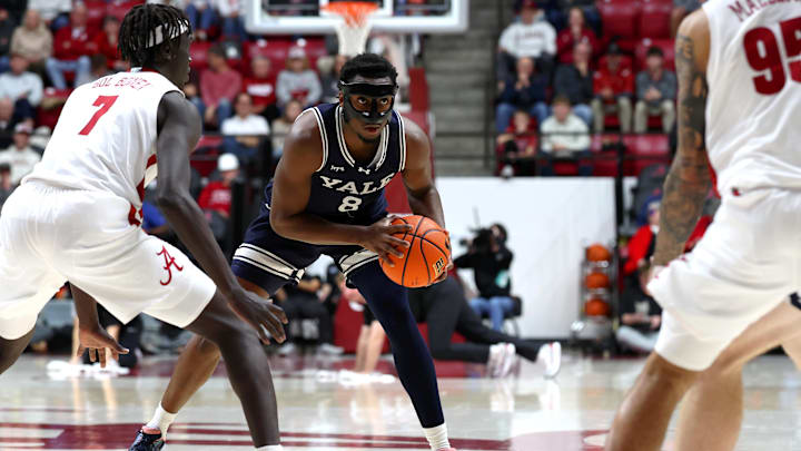 Dec 29, 2025; Tuscaloosa, Alabama, USA; Alabama Crimson Tide forward Taylor Bol Bowen (7) guards Yale Bulldogs forward Isaac Celiscar (8) during the second half at Coleman Coliseum. Mandatory Credit: David Leong-Imagn Images Dec 29, 2025; Tuscaloosa, Alabama, USA; Alabama Crimson Tide forward Taylor Bol Bowen (7) guards Yale Bulldogs forward Isaac Celiscar (8) during the second half at Coleman Coliseum. Mandatory Credit: David Leong-Imagn Images