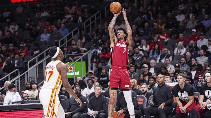 Feb 24, 2025; Atlanta, Georgia, USA; Miami Heat center Kel'el Ware (7) shoots over Atlanta Hawks forward Onyeka Okongwu (17) during the first half at State Farm Arena. Mandatory Credit: Dale Zanine-Imagn Images