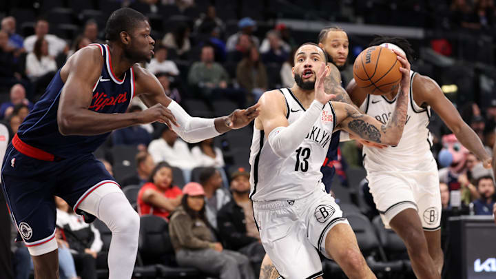 Jan 15, 2025; Inglewood, California, USA; Brooklyn Nets guard Tyrese Martin (13) drives against LA Clippers center Mo Bamba (4) during the second half at Intuit Dome. Mandatory Credit: Kiyoshi Mio-Imagn Images Jan 15, 2025; Inglewood, California, USA; Brooklyn Nets guard Tyrese Martin (13) drives against LA Clippers center Mo Bamba (4) during the second half at Intuit Dome. Mandatory Credit: Kiyoshi Mio-Imagn Images