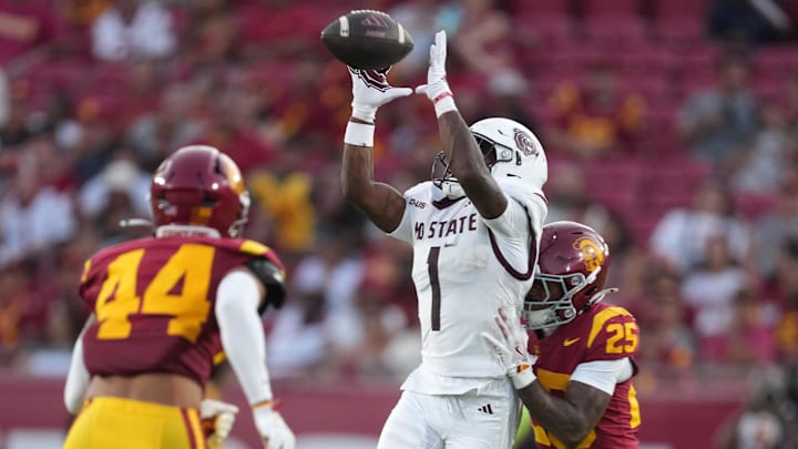 Aug 30, 2025; Los Angeles, California, USA; Missouri State Bears wide receiver Dash Luke (1) catches the ball against Southern California Trojans cornerback Marcelles Williams (25) and linebacker Matai Tagoa'i (44) in the second half at United Airlines Field at Los Angeles Memorial Coliseum. Mandatory Credit: Kirby Lee-Imagn Images