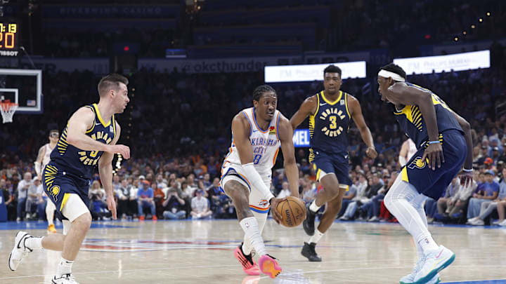 Mar 29, 2025; Oklahoma City, Oklahoma, USA; Oklahoma City Thunder forward Jalen Williams (8) drives between Indiana Pacers guard T.J. McConnell (9) and forward Pascal Siakam (43) during the second quarter at Paycom Center. Mandatory Credit: Alonzo Adams-Imagn Images