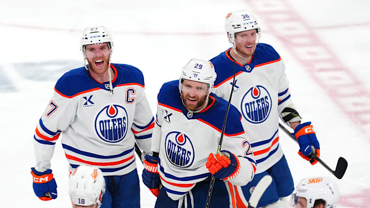 May 14, 2025; Las Vegas, Nevada, USA; Edmonton Oilers center Connor McDavid (97) celebrates with center Leon Draisaitl (29) and goaltender Olivier Rodrigue (35) after the Oilers defeated the Vegas Golden Knights 1-0 during an overtime victory, completing a 4-1 series win during game five of the second round of the 2025 Stanley Cup Playoffs at T-Mobile Arena. Mandatory Credit: Stephen R. Sylvanie-Imagn Images