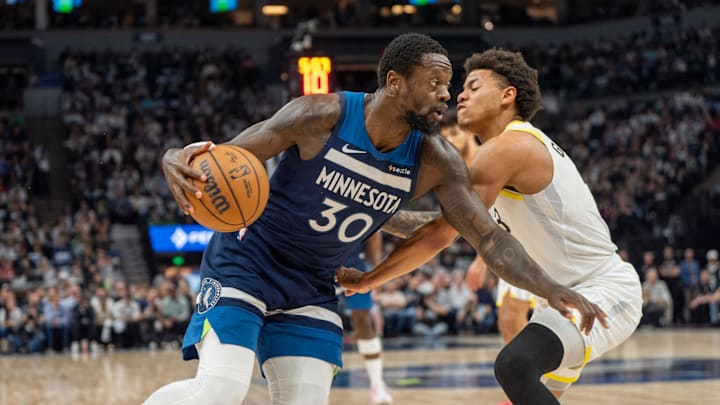 Apr 13, 2025; Minneapolis, Minnesota, USA; Minnesota Timberwolves forward Julius Randle (30) drives through the defense of Utah Jazz guard Keyonte George (3) in the first quarter at Target Center. Mandatory Credit: Matt Blewett-Imagn Images