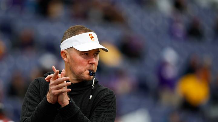 Nov 2, 2024; Seattle, Washington, USA; USC Trojans head coach Lincoln Riley watches pregame warmups against the Washington Huskies at Alaska Airlines Field at Husky Stadium. Mandatory Credit: Joe Nicholson-Imagn Images