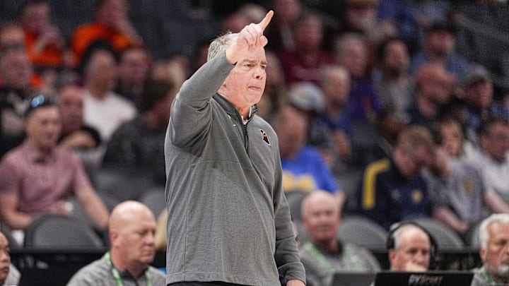 Mar 11, 2025; Charlotte, NC, USA; Virginia Tech Hokies head coach Mike Young signals to his team during the first half against the California Golden Bears at Spectrum Center. Mandatory Credit: Jim Dedmon-Imagn Images