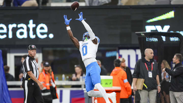 Aug 8, 2024; East Rutherford, New Jersey, USA;  Detroit Lions cornerback Terrion Arnold (0) makes a catch during warmup prior to the game between the New York Giants and Detroit Lions at MetLife Stadium. Mandatory Credit: Scott Rausenberger-Imagn Images