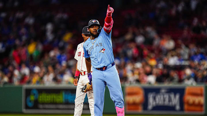 Aug 29, 2024; Boston, Massachusetts, USA; Toronto Blue Jays designated hitter Vladimir Guerrero Jr. (27) reacts after hitting a double to drive in a run against the Boston Red Sox  in the third inning at Fenway Park.