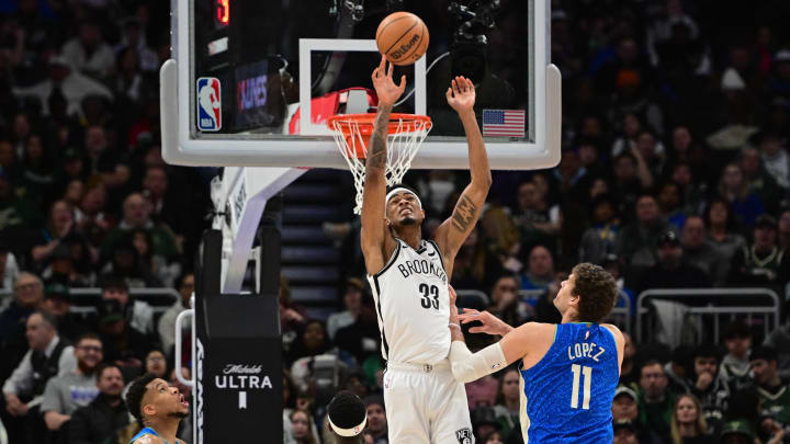 Mar 21, 2024; Milwaukee, Wisconsin, USA; Brooklyn Nets center Nicolas Claxton (33) reaches for the ball against Milwaukee Bucks center Brook Lopez (11) in the third quarter at Fiserv Forum. Mandatory Credit: Benny Sieu-USA TODAY Sports Mar 21, 2024; Milwaukee, Wisconsin, USA; Brooklyn Nets center Nicolas Claxton (33) reaches for the ball against Milwaukee Bucks center Brook Lopez (11) in the third quarter at Fiserv Forum. Mandatory Credit: Benny Sieu-USA TODAY Sports