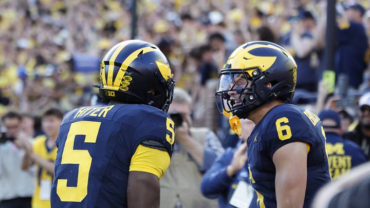 Sep 26, 2026; Ann Arbor, Michigan, USA; Michigan Wolverines wide receiver JJ Buchanan (6) celebrates with running back Savion Hiter (5) after scoring a touchdown against the Iowa Hawkeyes during the second half at Michigan Stadium. Mandatory Credit: Rick Osentoski-Imagn Images Sep 26, 2026; Ann Arbor, Michigan, USA; Michigan Wolverines wide receiver JJ Buchanan (6) celebrates with running back Savion Hiter (5) after scoring a touchdown against the Iowa Hawkeyes during the second half at Michigan Stadium. Mandatory Credit: Rick Osentoski-Imagn Images