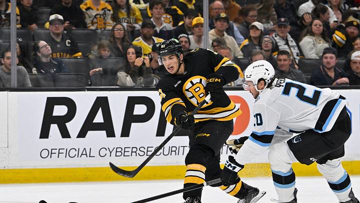 Oct 8, 2026; Boston, Massachusetts, USA; Boston Bruins center Matthew Poitras (51) shoots the puck through the defense of Utah Mammoth defenseman Andrew Peeke (20) during the third period at TD Garden. Mandatory Credit: Eric Canha-Imagn Images Oct 8, 2026; Boston, Massachusetts, USA; Boston Bruins center Matthew Poitras (51) shoots the puck through the defense of Utah Mammoth defenseman Andrew Peeke (20) during the third period at TD Garden. Mandatory Credit: Eric Canha-Imagn Images
