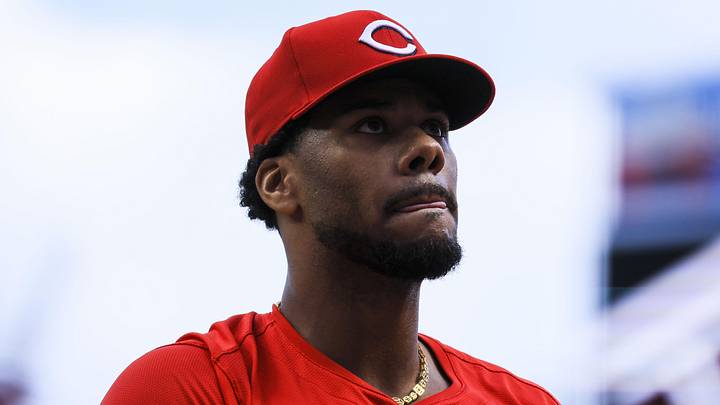 Cincinnati Reds starting pitcher Hunter Greene (21) walks