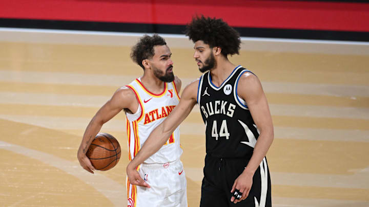 Dec 14, 2024; Las Vegas, Nevada, USA; Atlanta Hawks guard Trae Young (11) and Milwaukee Bucks guard Andre Jackson Jr. (44) react during the fourth quarter in a semifinal of the 2024 Emirates NBA Cup at T-Mobile Arena. Mandatory Credit: Candice Ward-Imagn Images Dec 14, 2024; Las Vegas, Nevada, USA; Atlanta Hawks guard Trae Young (11) and Milwaukee Bucks guard Andre Jackson Jr. (44) react during the fourth quarter in a semifinal of the 2024 Emirates NBA Cup at T-Mobile Arena. Mandatory Credit: Candice Ward-Imagn Images