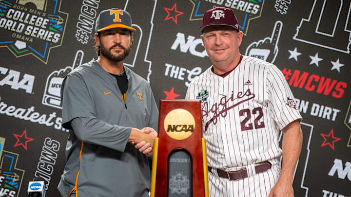 Tennessee head coach Tony Vitello and Texas A&M head coach Jim Schlossnagle pose for a photo with the championship trophy during a press conference before the NCAA College World Series finals at Charles Schwab Field in Omaha, Neb., on Friday, June 21, 2024.