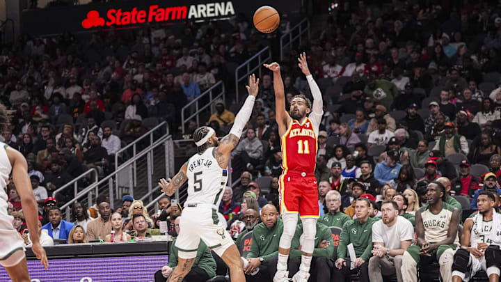 Mar 4, 2025; Atlanta, Georgia, USA; Atlanta Hawks guard Trae Young (11) shoots over Milwaukee Bucks guard Gary Trent Jr. (5) during the second half at State Farm Arena. Mandatory Credit: Dale Zanine-Imagn Images