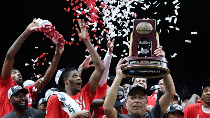 Houston Cougars head coach Kelvin Sampson holds the trophy on stage after defeating the Tennessee Volunteers during the Midwest Regional final of the 2025 NCAA tournament at Lucas Oil Stadium. Houston Cougars head coach Kelvin Sampson holds the trophy on stage after defeating the Tennessee Volunteers during the Midwest Regional final of the 2025 NCAA tournament at Lucas Oil Stadium.