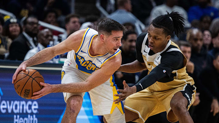 Dec 14, 2025; Indianapolis, Indiana, USA; Indiana Pacers guard T.J. McConnell (9) holds the ball while Washington Wizards guard Bub Carrington (7) defends in the second half at Gainbridge Fieldhouse. Mandatory Credit: Trevor Ruszkowski-Imagn Images Dec 14, 2025; Indianapolis, Indiana, USA; Indiana Pacers guard T.J. McConnell (9) holds the ball while Washington Wizards guard Bub Carrington (7) defends in the second half at Gainbridge Fieldhouse. Mandatory Credit: Trevor Ruszkowski-Imagn Images