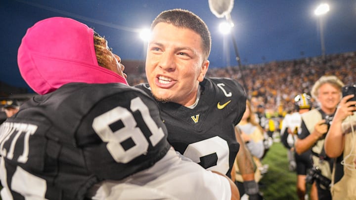 Oct 25, 2025; Nashville, Tennessee, USA;  Vanderbilt Commodores quarterback Diego Pavia (2) and wide receiver Kayleb Barnett (81) celebrate the win against the Missouri Tigers during the second half at FirstBank Stadium. Mandatory Credit: Steve Roberts-Imagn Images