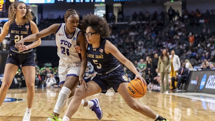 Mar 29, 2025; Birmingham, AL, USA; Notre Dame Fighting Irish guard Olivia Miles (5) works against TCU Horned Frogs guard Agnes Emma-Nnopu (21) during the first half of a Sweet 16 NCAA Tournament basketball game at Legacy Arena. Mandatory Credit: Vasha Hunt-Imagn Images